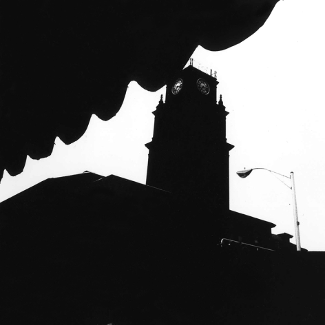 Abstracted black and white photo of a clock tower.